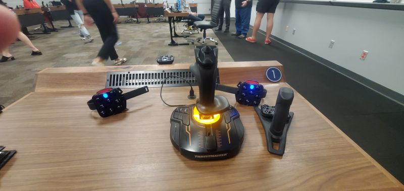 The controllers and hand tracking desks used during the VR interactive session