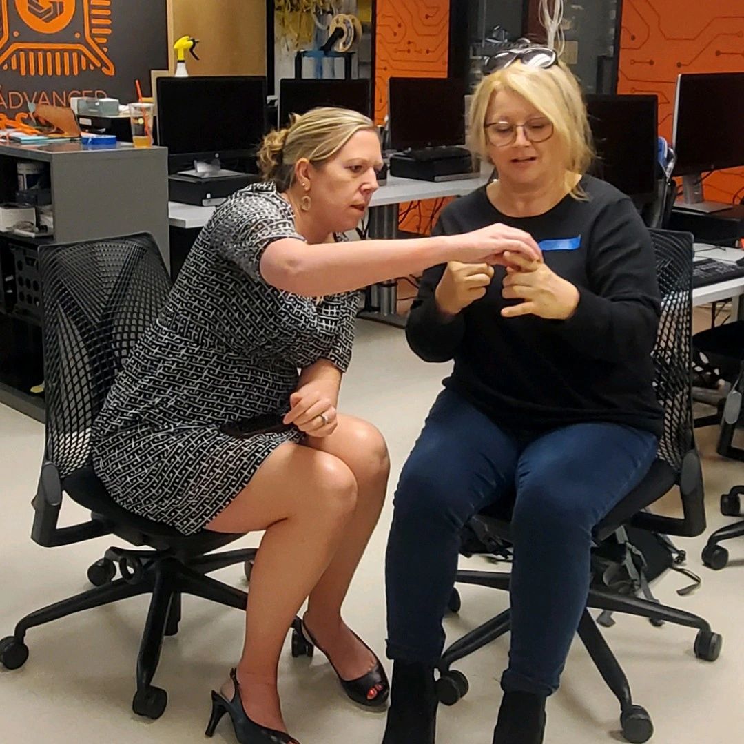 Two people working through the lockpicking activity together