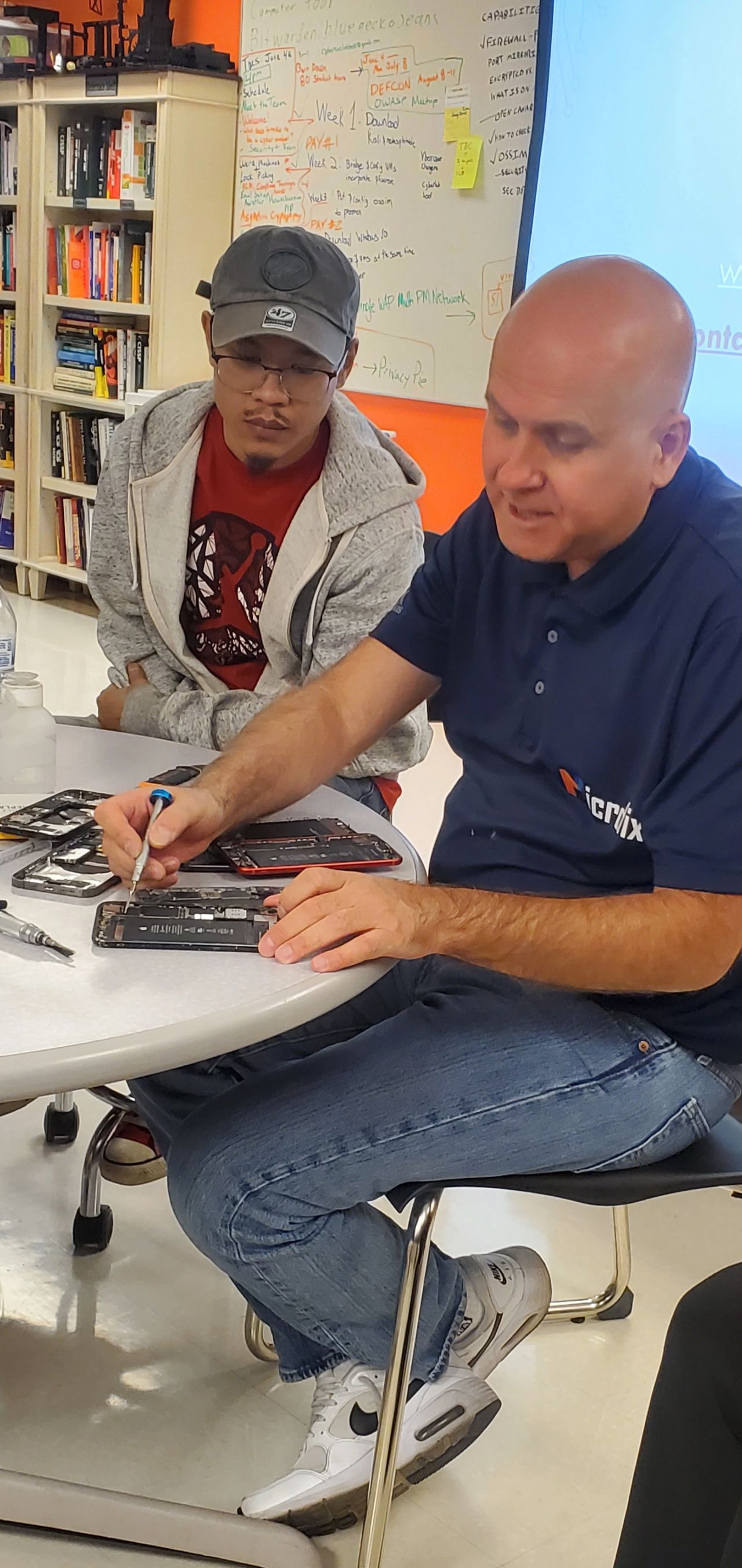 Mustafa illustrating more of what each internal component is in an iphone